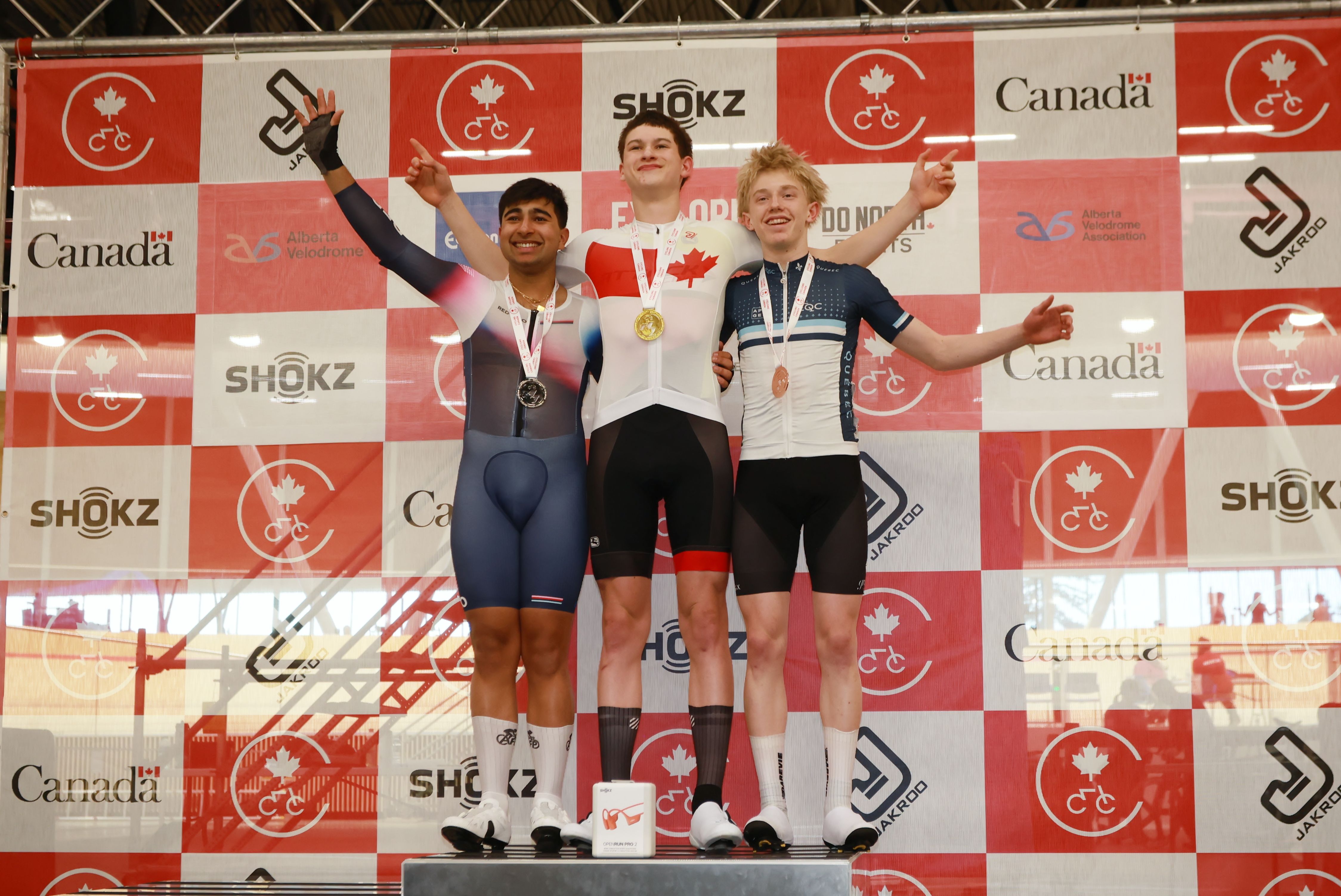Medallists celebrate on the podium