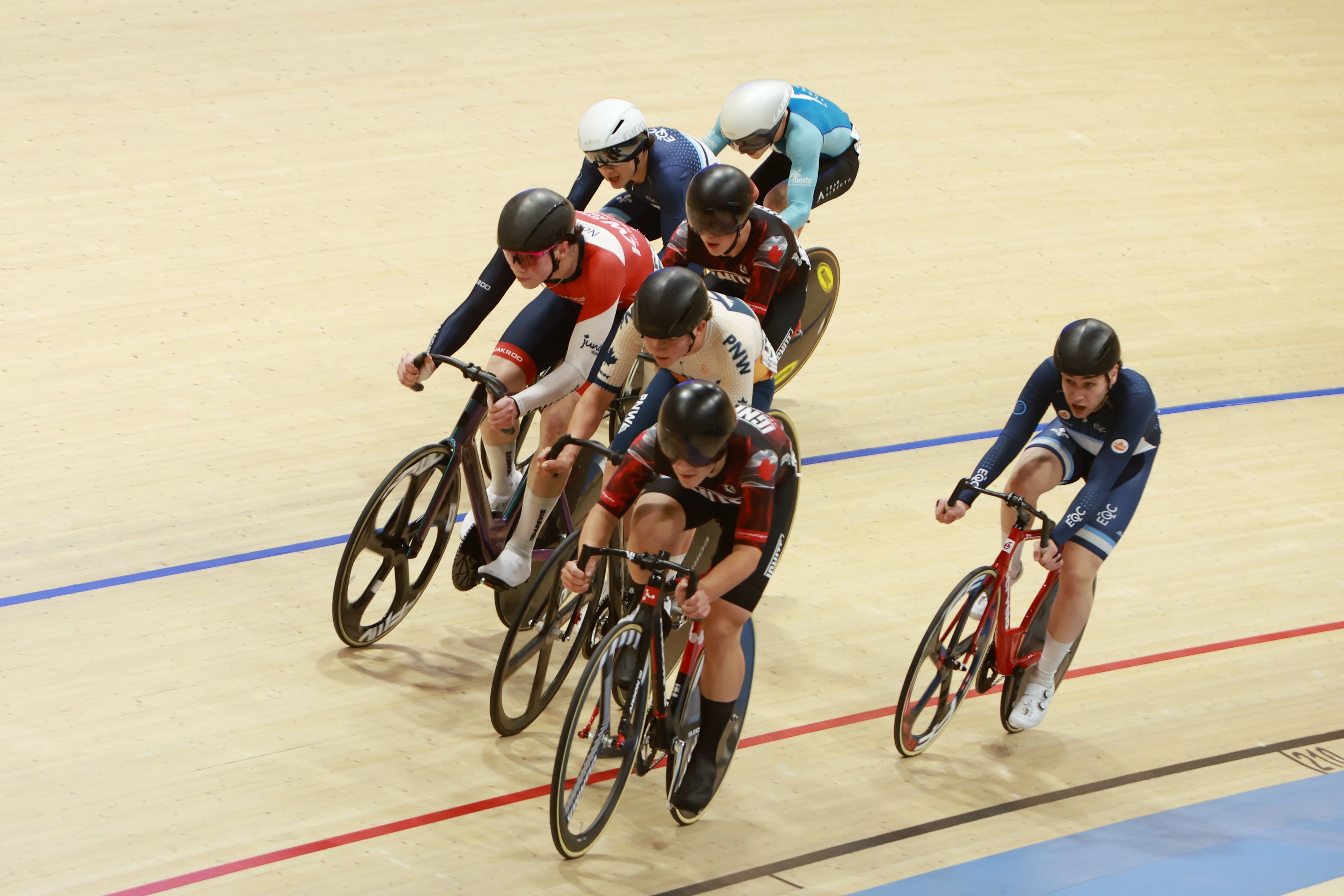 Sprinters dive down the banking mid-race