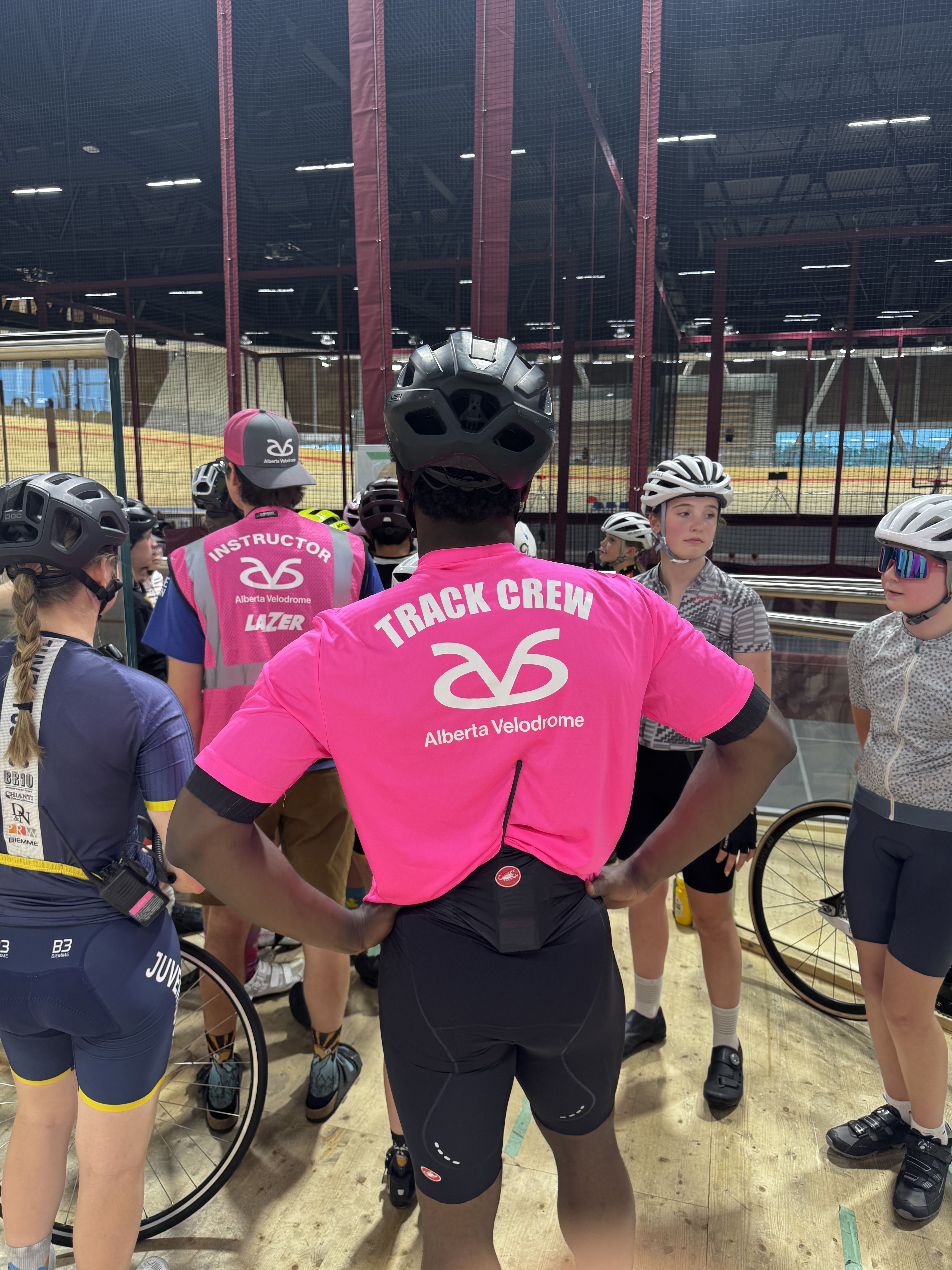Alberta Velodrome track crew briefing a group of young riders