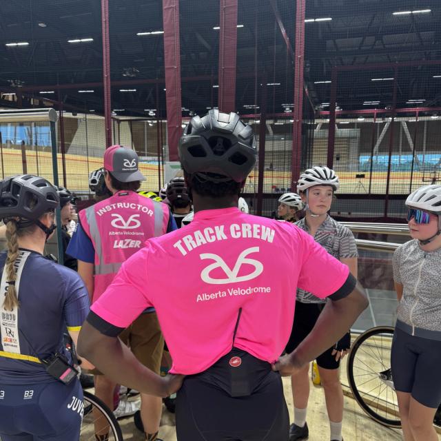 Alberta Velodrome track crew briefing a group of young riders