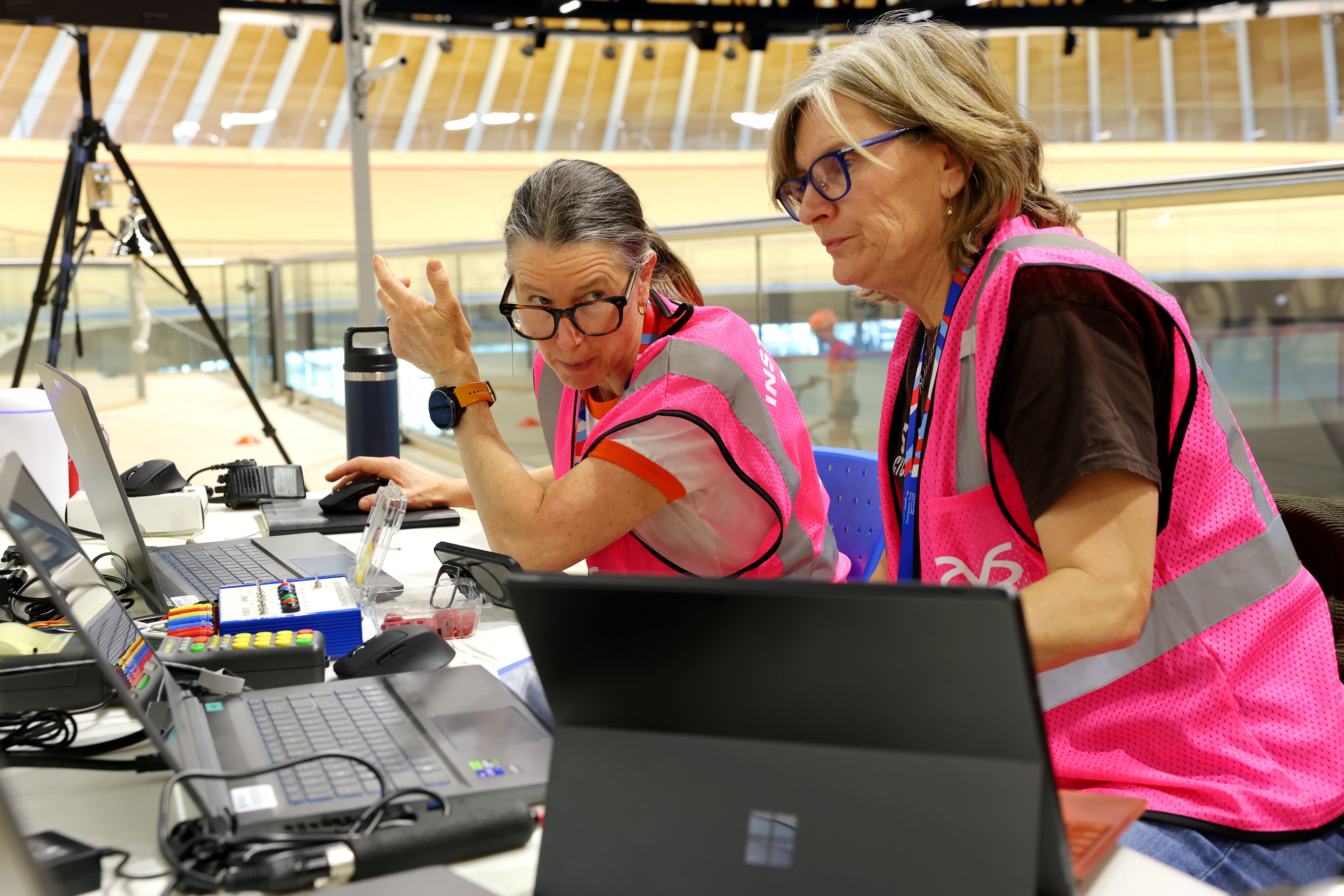 Volunteer instructors at the timing desk