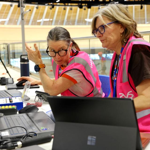 Volunteer instructors at the timing desk