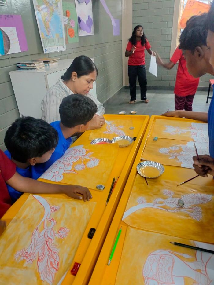 Empowering young minds through heritage — where mural art and rhythm come alive at Attappadi. 