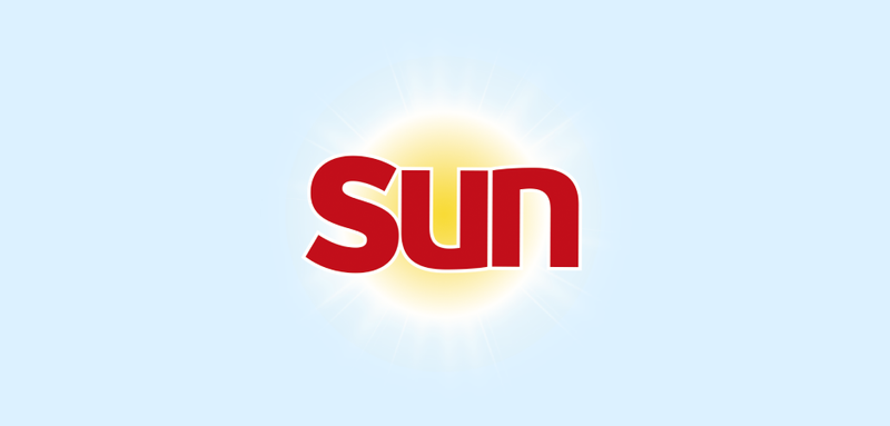 a sun logo with the sun shining in the background