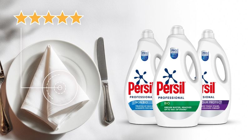 A five-star rated place setting next to three bottles of Persil Professional laundry detergent, with text 'THE DOSE THAT DOES THE BUSINESS'.
