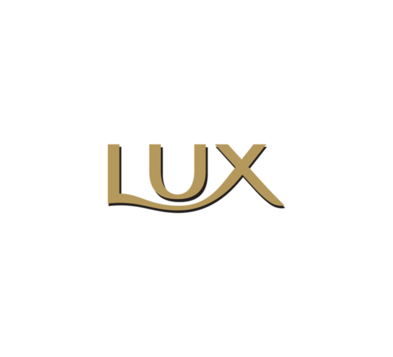 Lux-Logo in goldener Schrift mit schwarzem Schatten