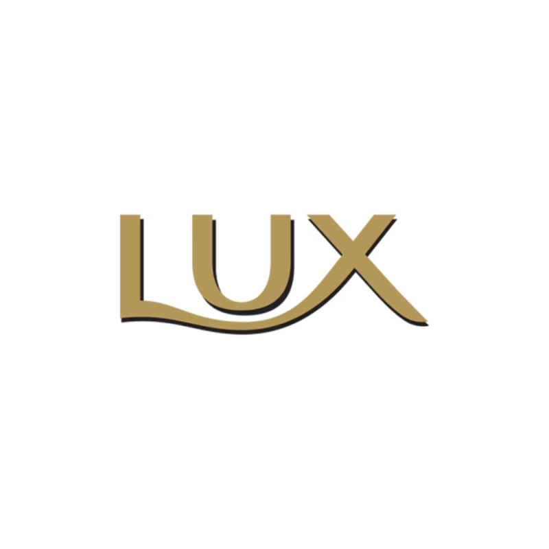 Logo Lux ve zlatém písmu s černým stínem