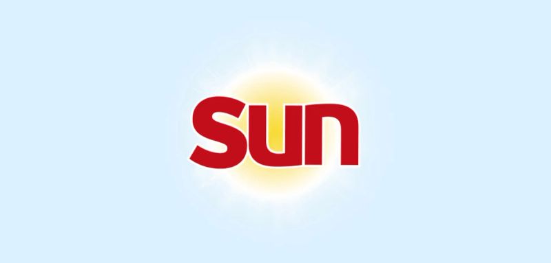 a red sun logo on a blue background