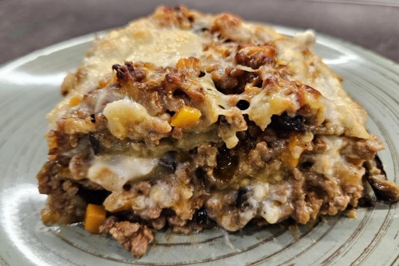 A portion of eggplant lasagna served on a plate.