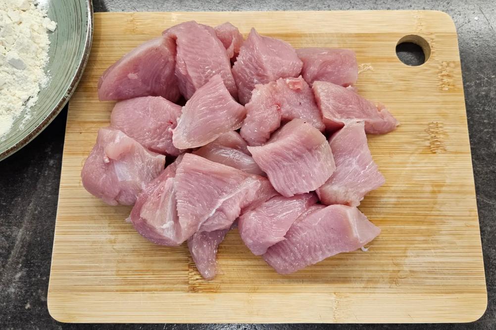 Turkey pieces lightly coated in flour before browning.