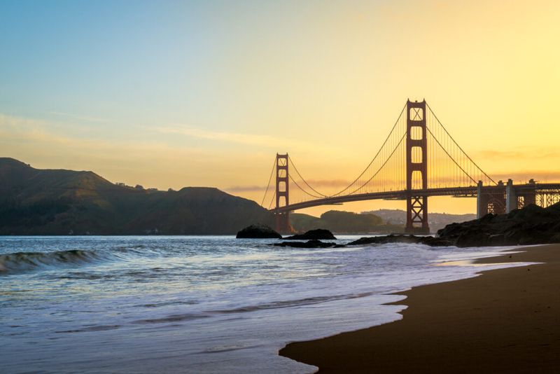 Golden Gate Bridge against the background of a gold sunrise