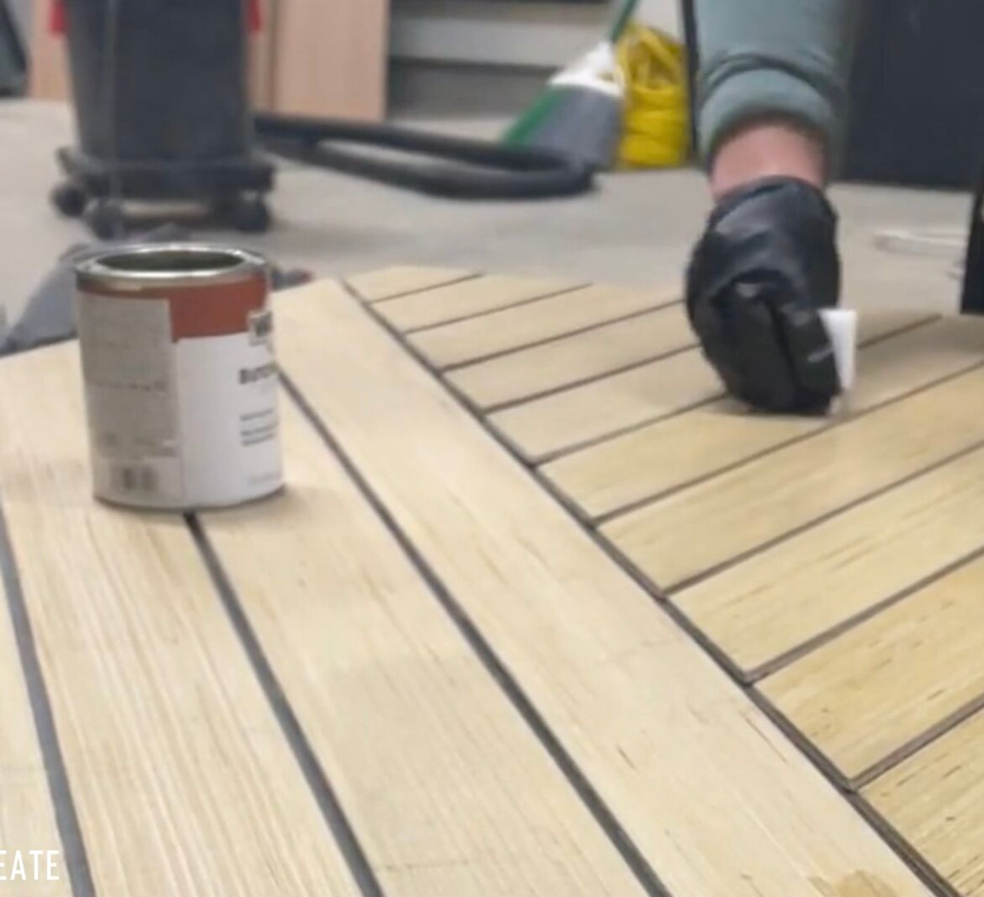 Wiping the Weathered Oak stain across the slats