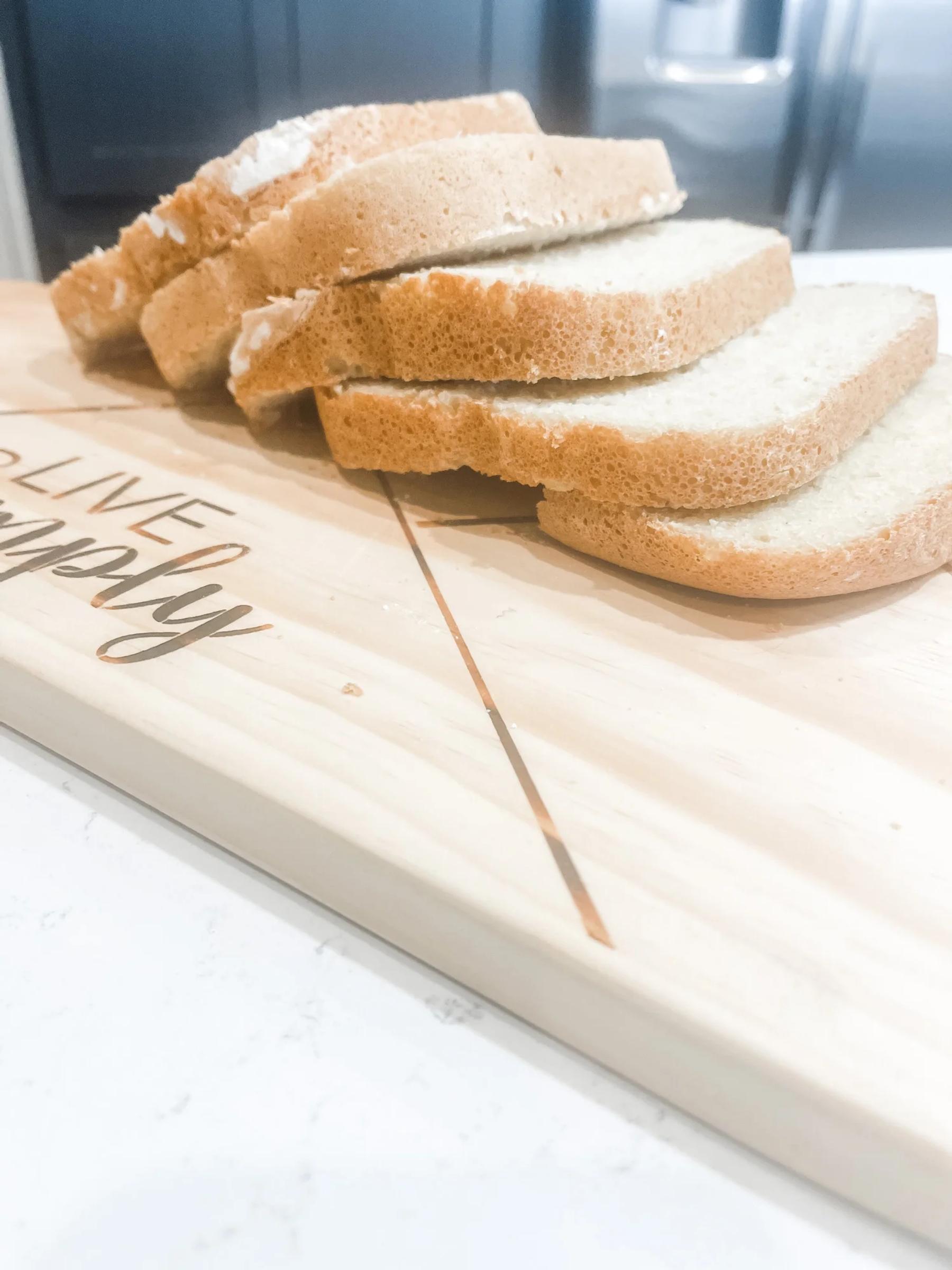 Slices of golden gluten-free sandwich bread on a wooden board
