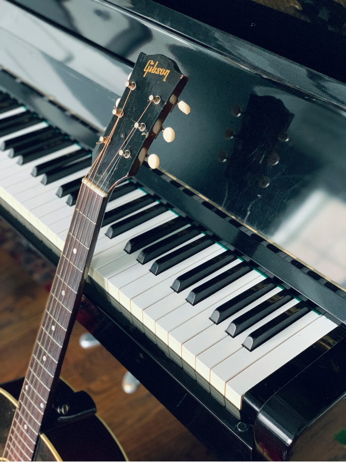 piano and guitar in a music classroom at Austra Training Institute.