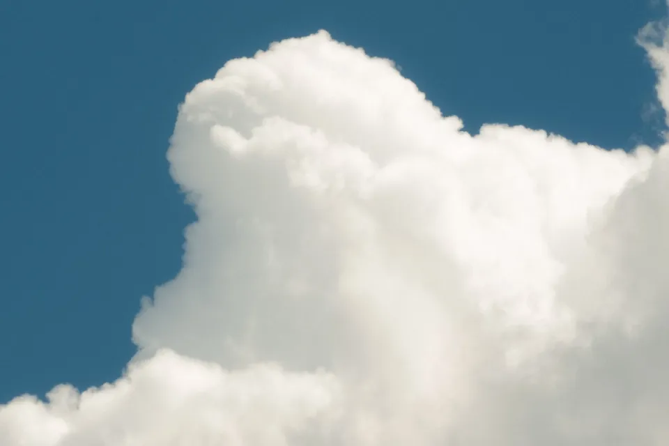 Large white cloud against a blue sky.