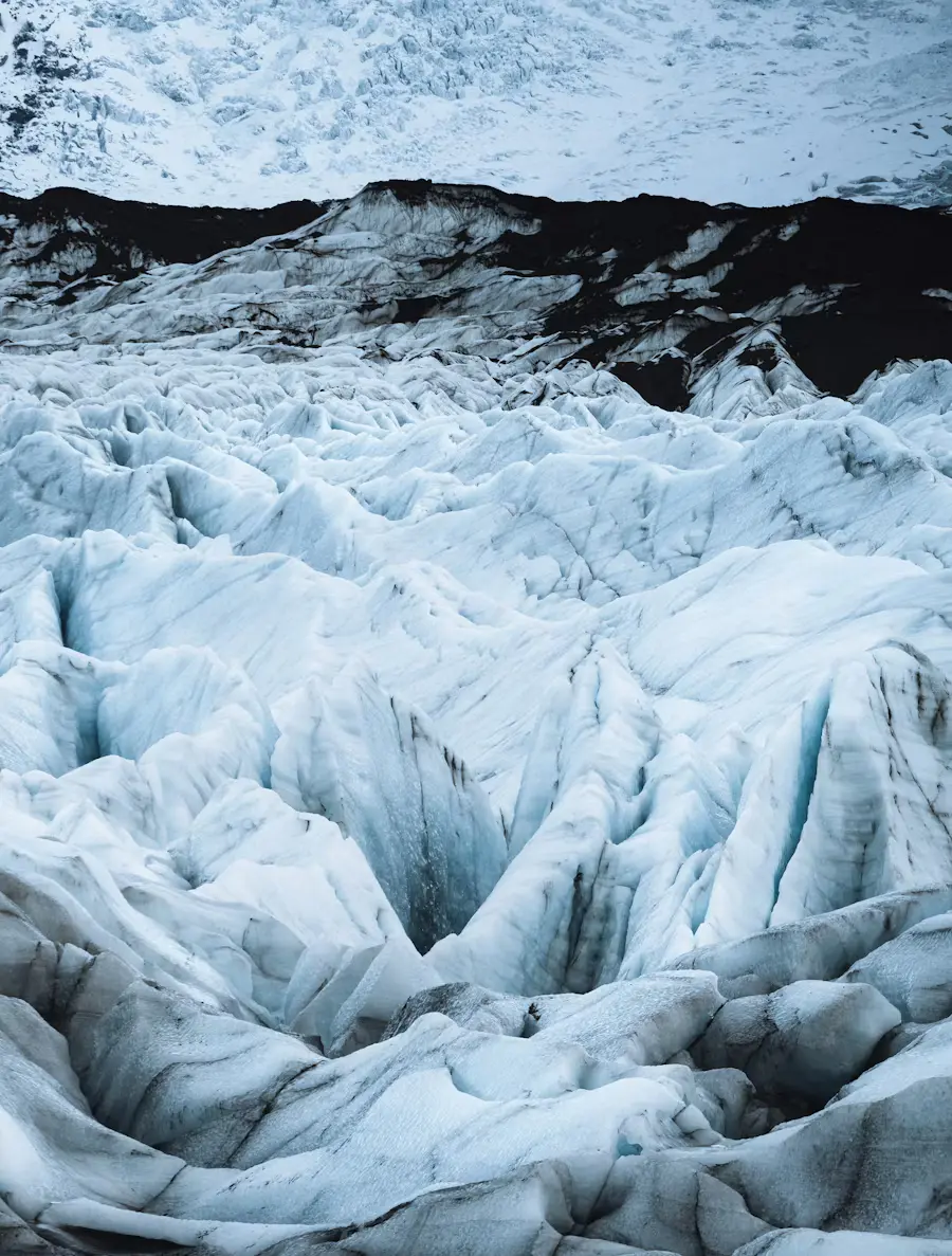 Single wind turbine in a field under a clear sky.