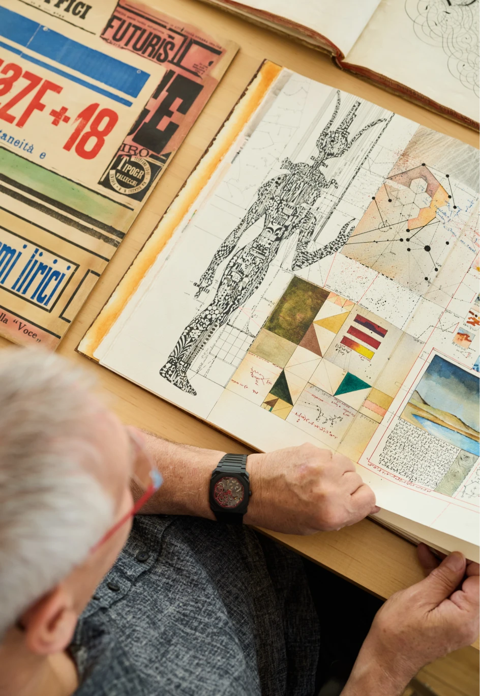 Rob Saunders from Letterform Archive turning the page of an artist book by Ardengo Soffici featuring lettering.