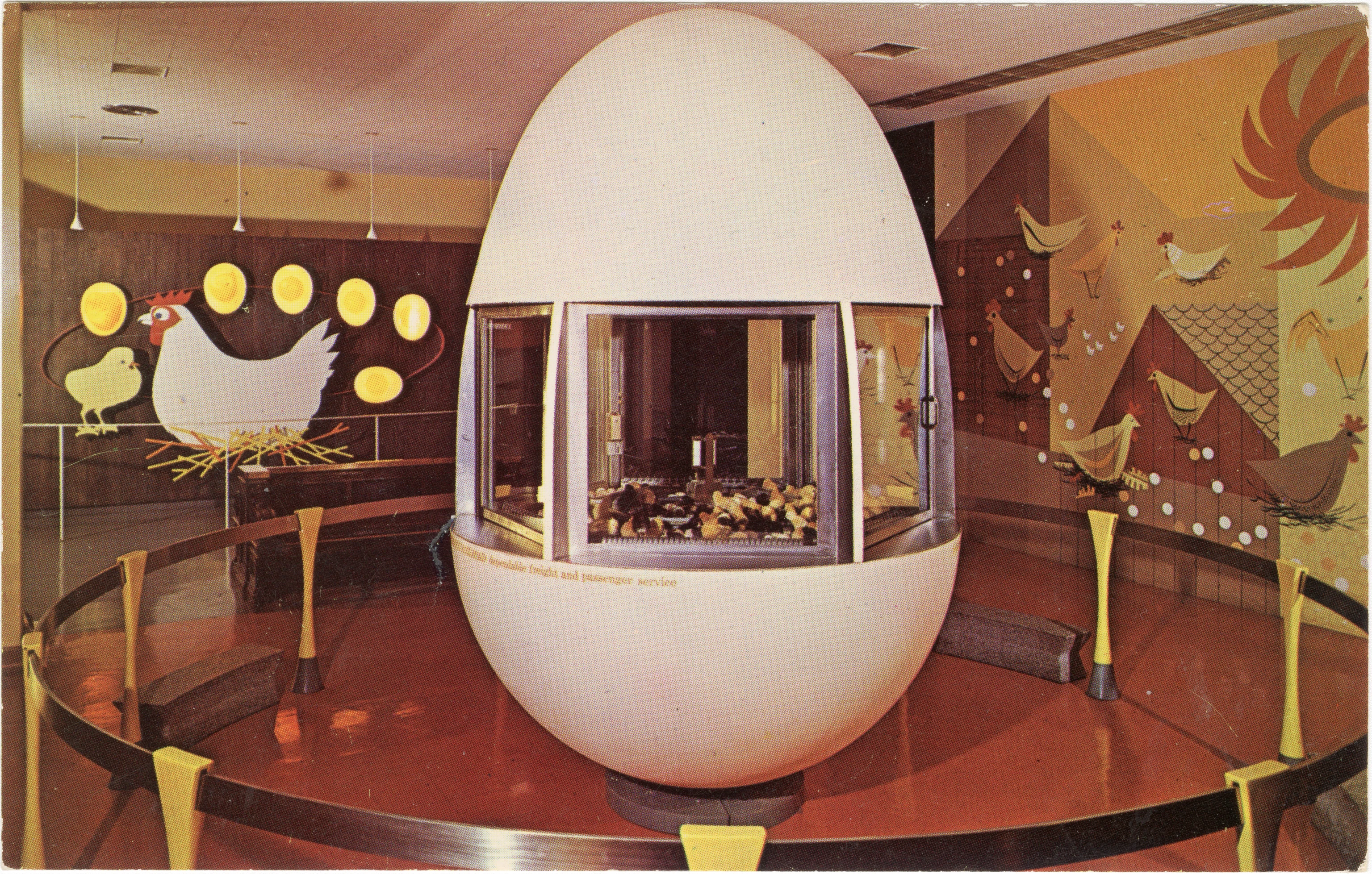 Postcard of the Giant Egg installation from the Eames Mathematica exhibition which hatches 150 eggs as baby chicks daily.