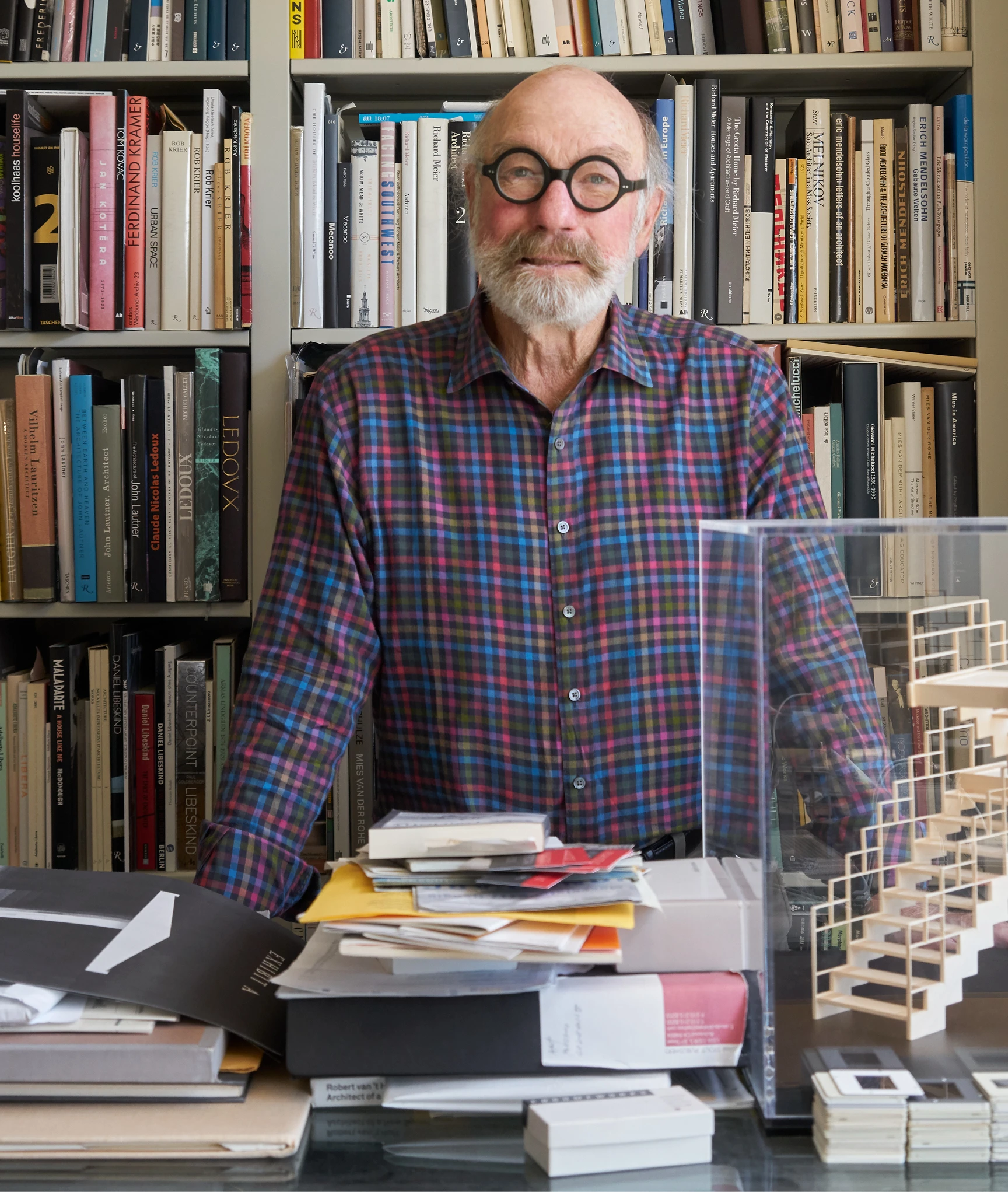 Close up of William Stout among the bookshelves at William Stout Architectural Books in San Francisco