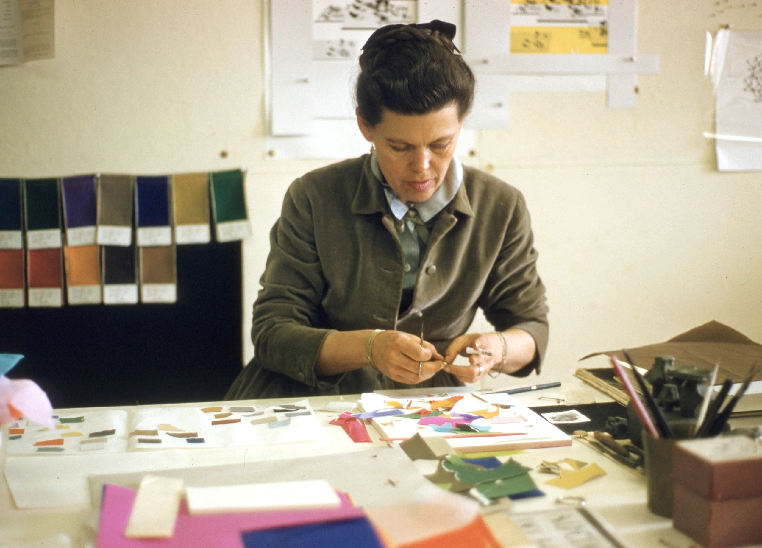 Ray Eames working on color and composition study for Mathematica: A World of Numbers… and Beyond. Image © Eames Office, LLC