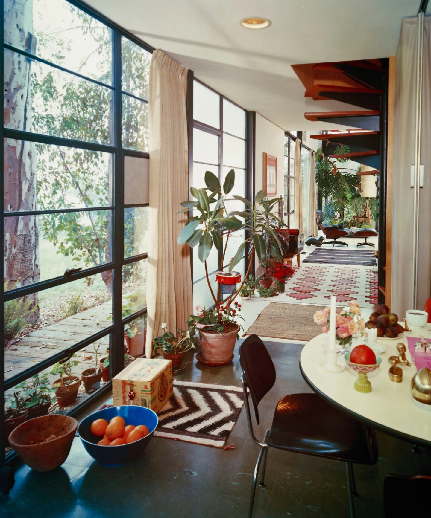 Eames Case Study House 8 interior featuring several Eames furniture pieces.