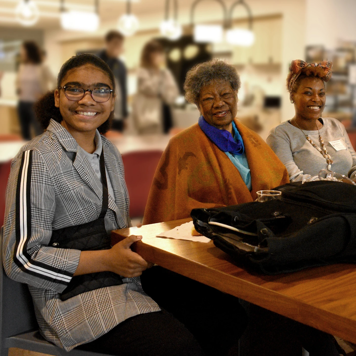 An Inneract Project design student seated next to her grandmother at an event.