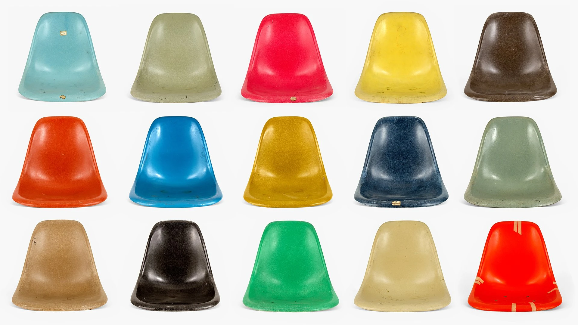 Rows of the fiberglass Eames chair shells in many colors.