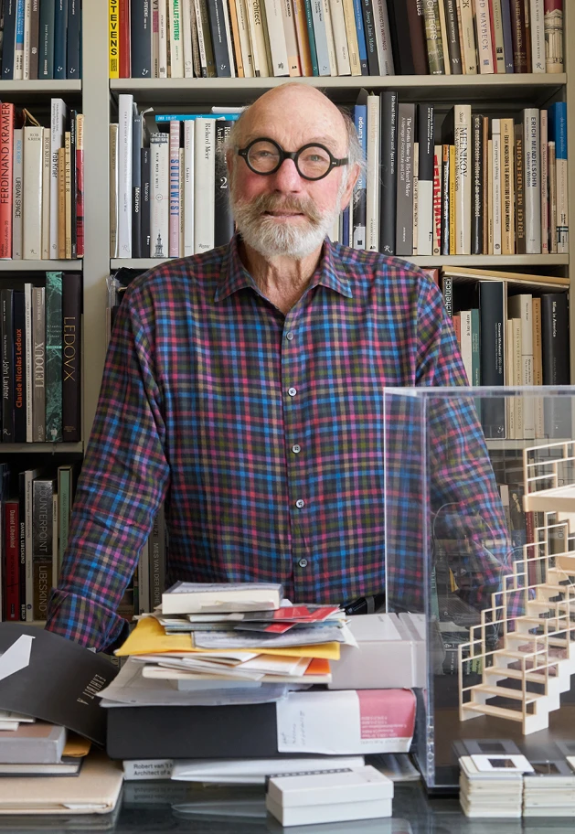 Close up of William Stout among the bookshelves at William Stout Architectural Books in San Francisco.