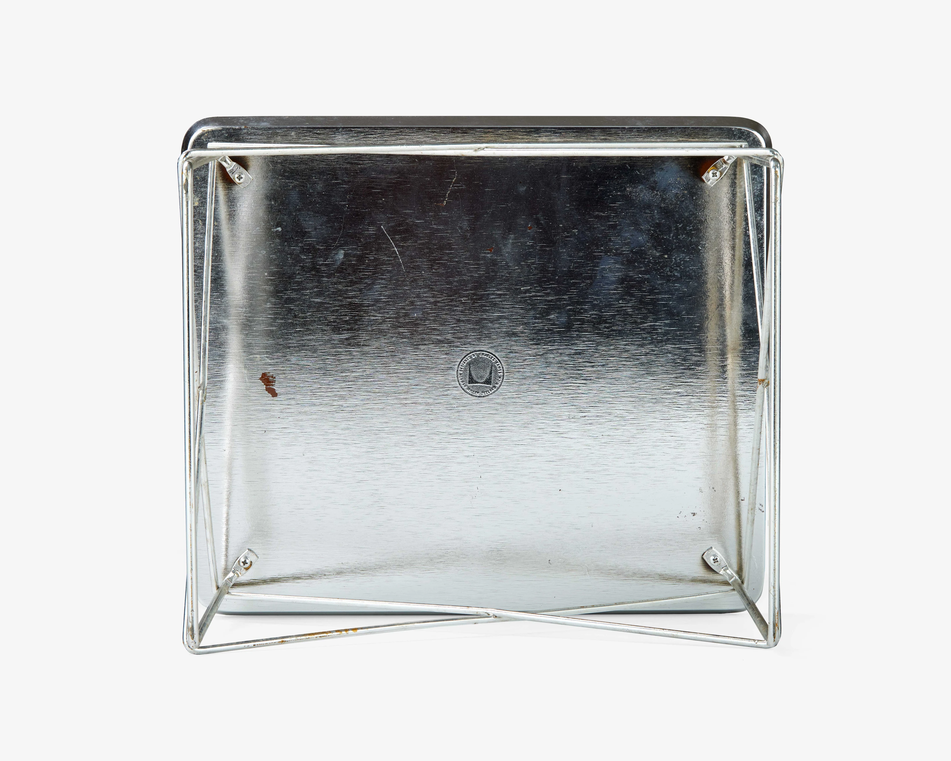 Underside view of a silver coated Eames LTR table. These tables were used as side tables, children’s play tables, or stools.