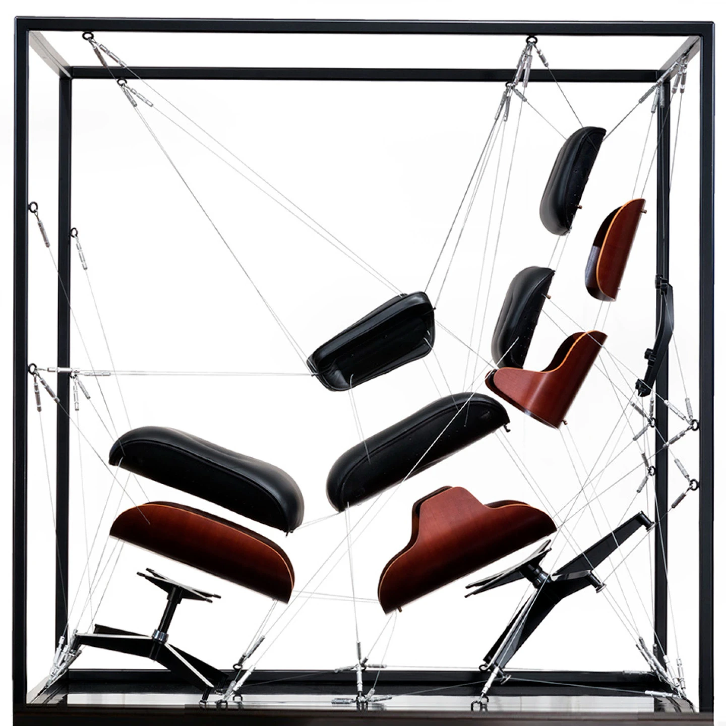 Eames, lounge chair and ottoman installation showing all of the components in an “exploded view”.