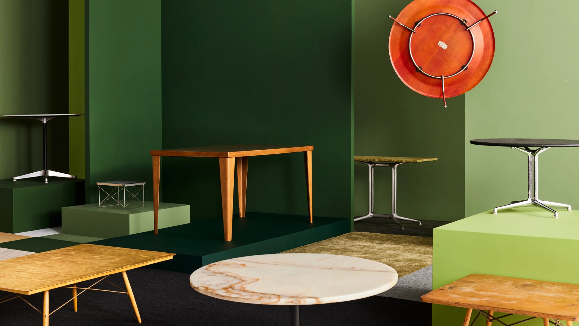 The furniture design of Eames tables on display demonstrates the broad spectrum of their design talents.