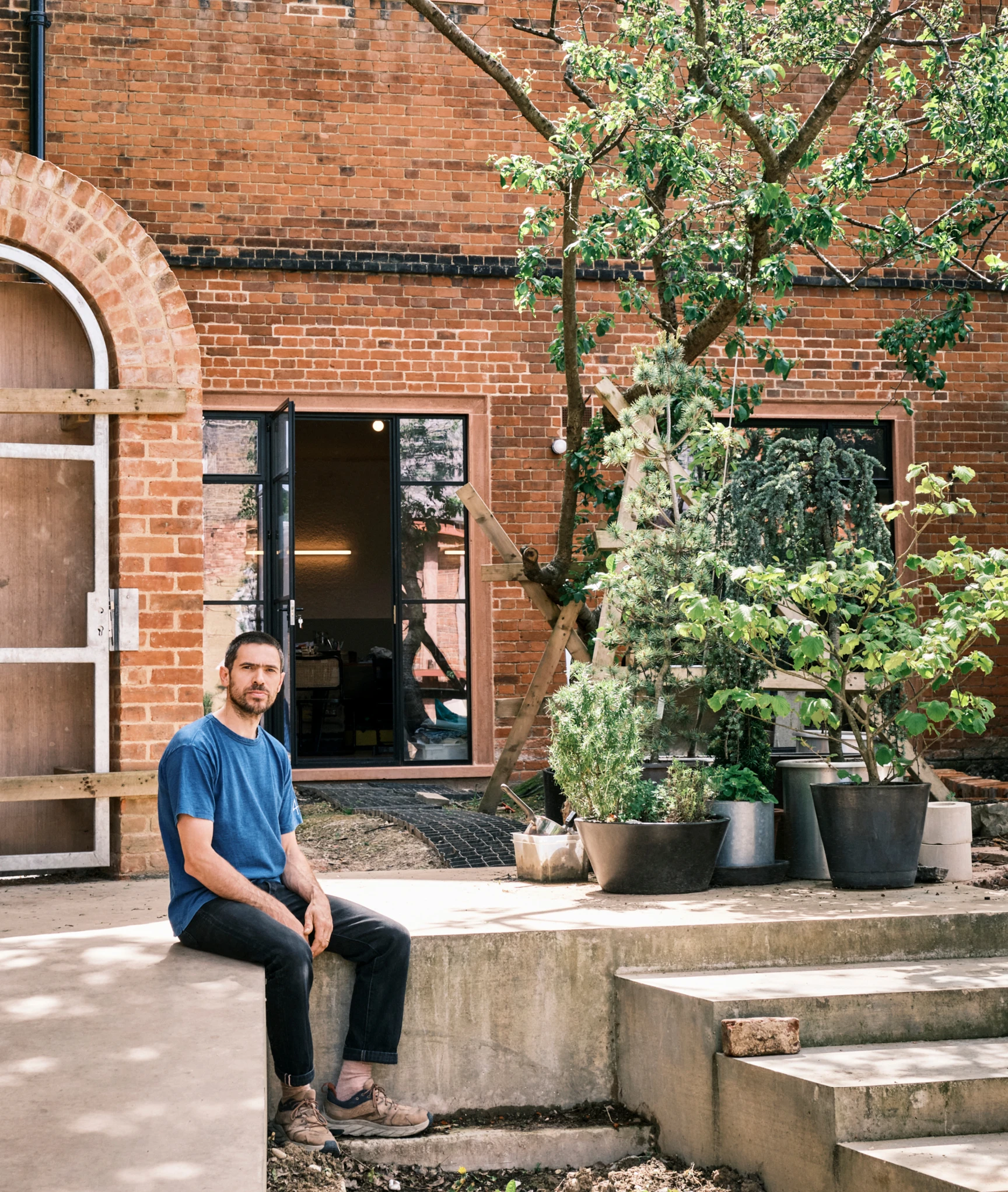 Furniture designer Max Lamb outside his workshop.
