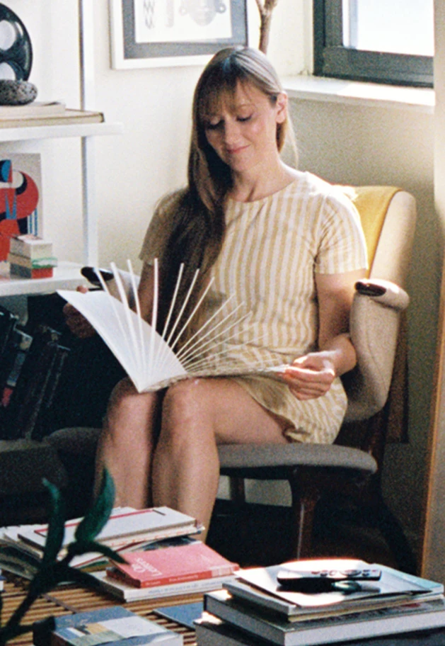 Designer and paper engineer Kelli Anderson flipping through a book she designed.