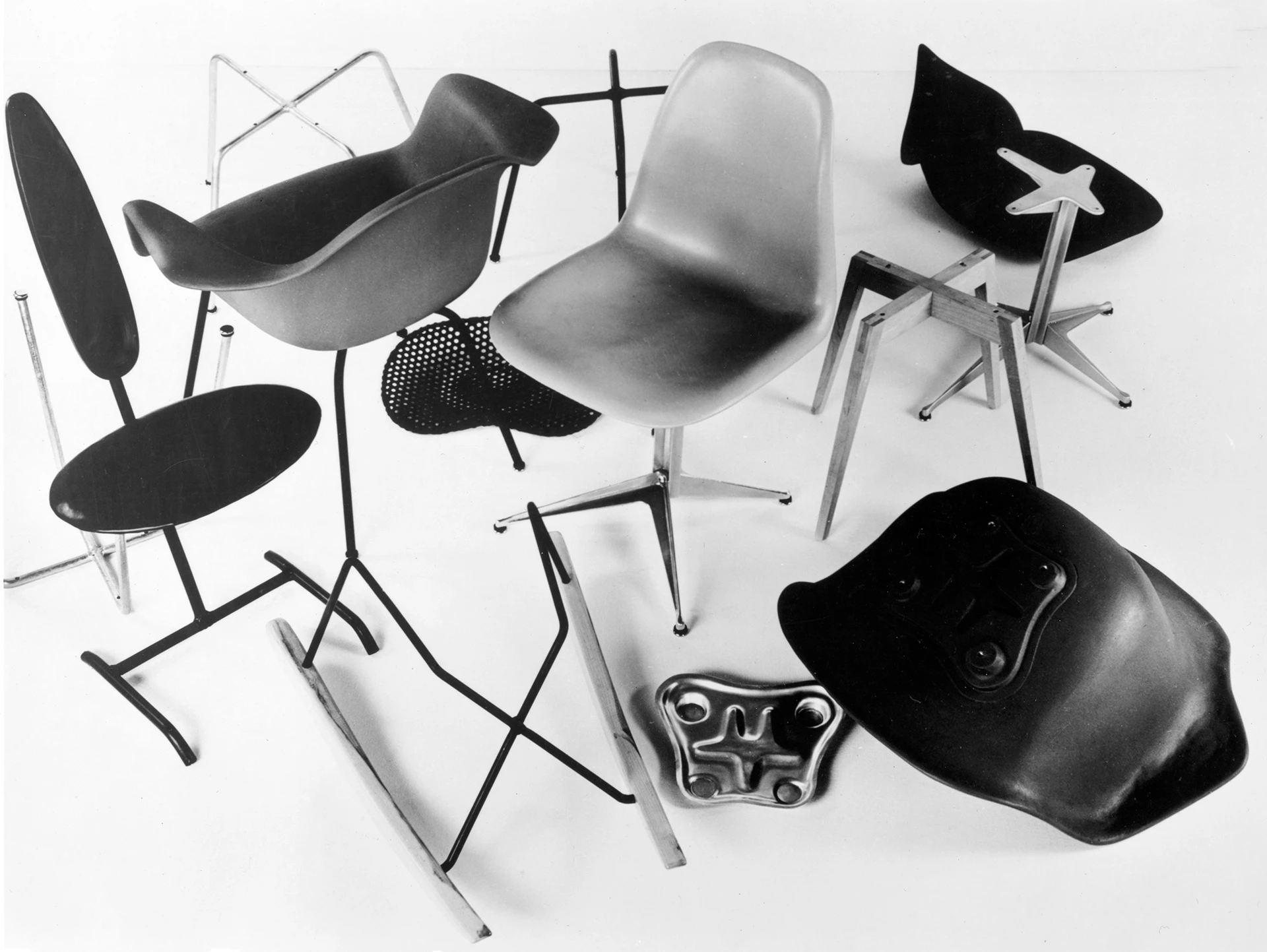 Eames chairs for the Entry Panel for MoMA's International Competition for Low-Cost Furniture Design which consists of multiple Eames chairs and bases grouped together.