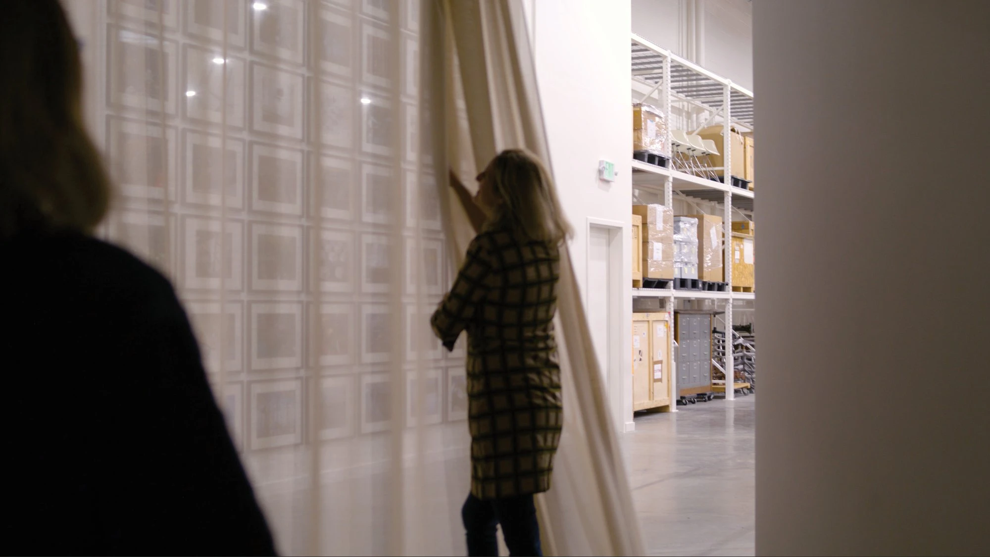 Llisa Demetrios, chief curator of the Eames Institute and granddaughter of Charles Eames in the gallery giving a tour.