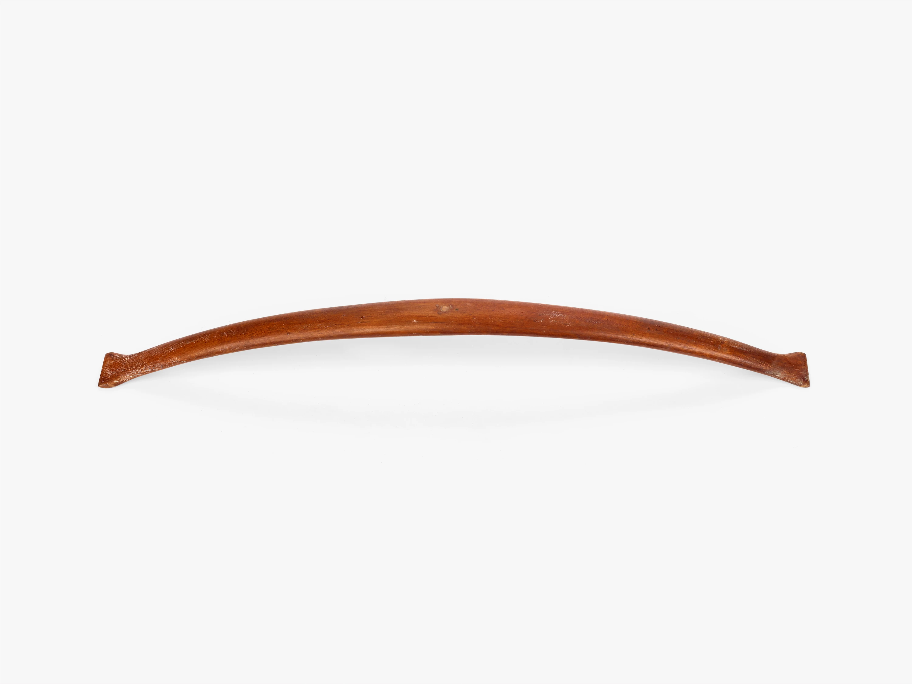 Eames Aluminum Group spreader wood prototype which has a slight curve and is very simple with small bends on either side.