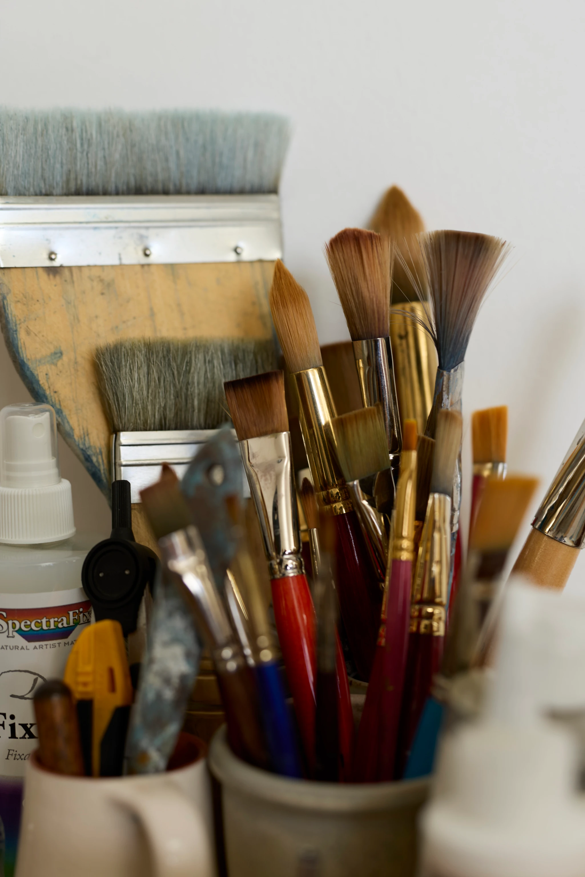 Close up of several paint brushes at the Eames Ranch Studios.