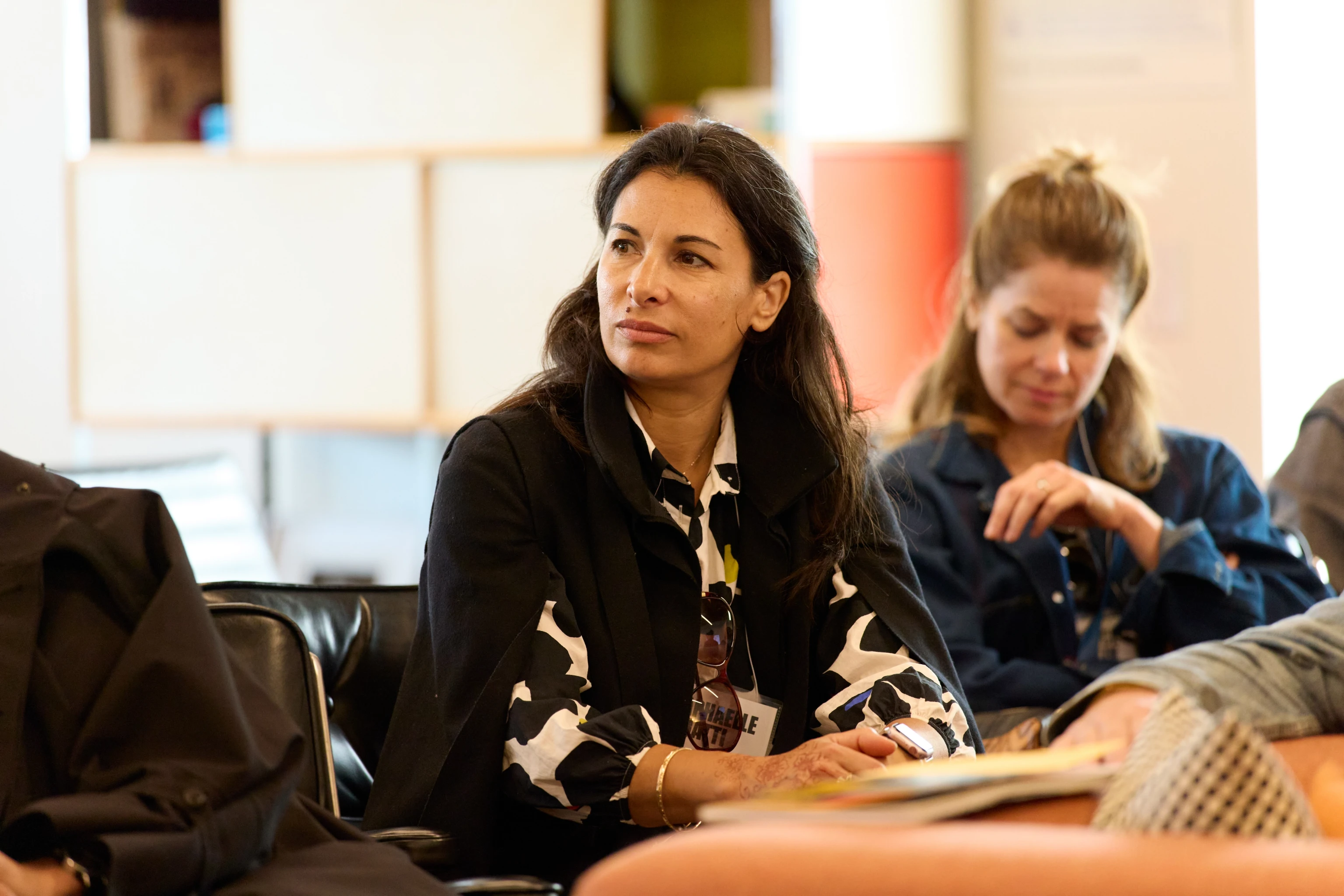 A Design Vanguard member listening to a talk during a Design Vanguard event