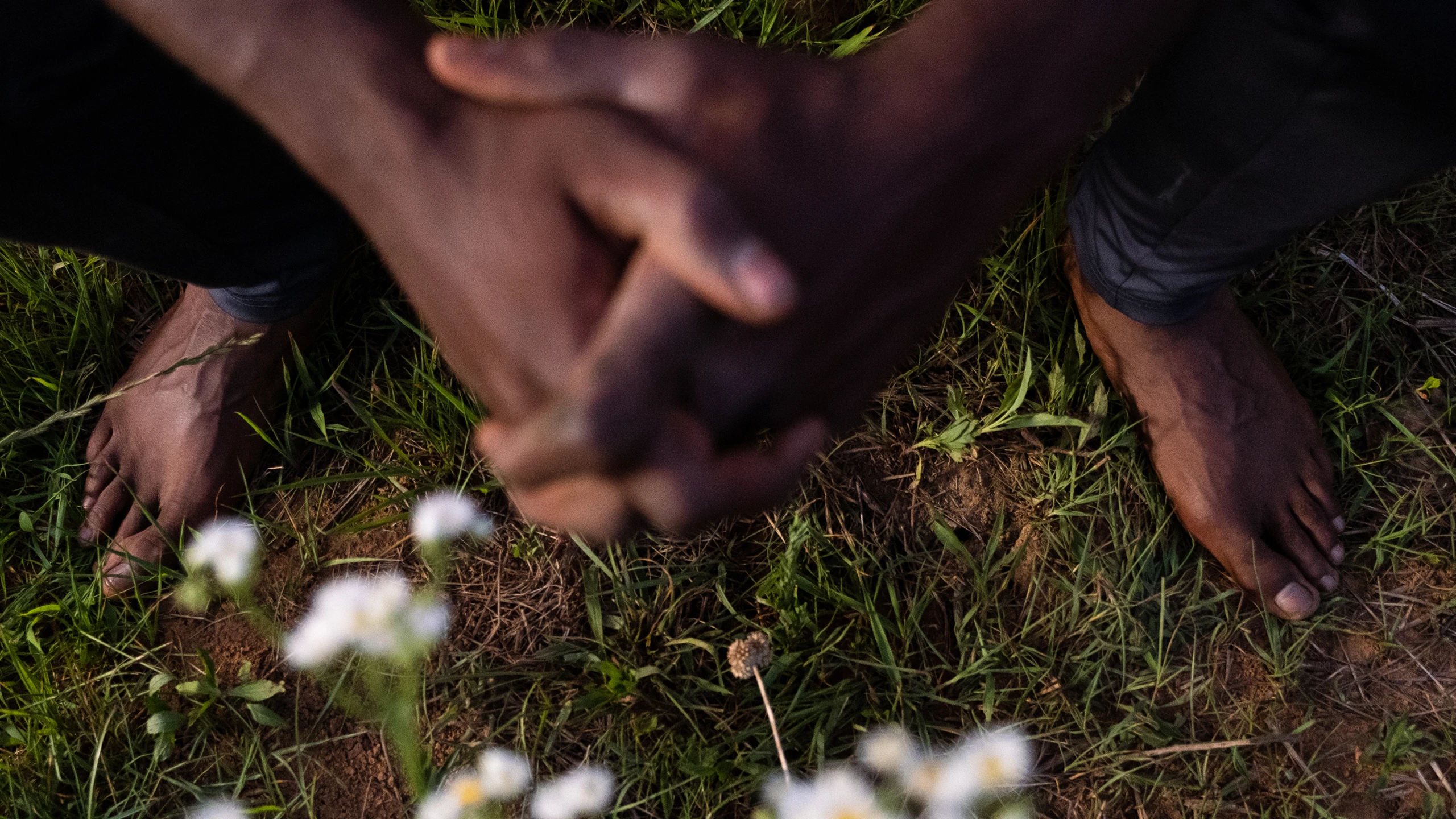 Close up of Sankofa Farms founder Kamal Bell’s hands, Kazam! Magazine.