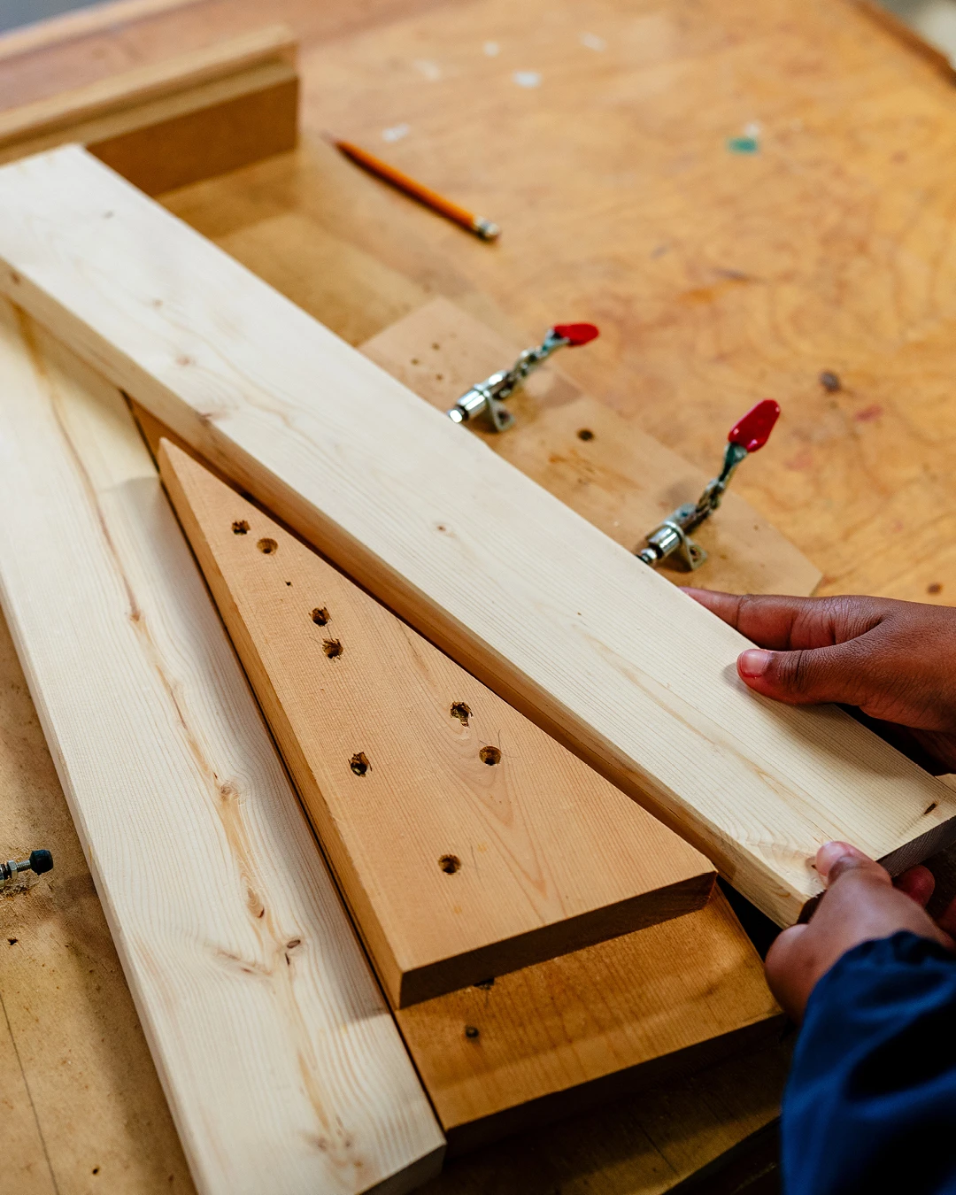 Custom jigs help the Brightmoor Maker Space students cut furniture components to exact size for a stool, Kazam! Magazine.