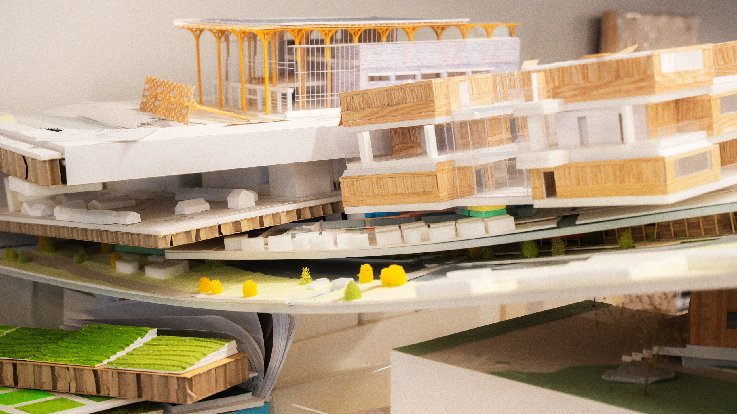 Several architectural models, including one for Nine Bridges Country Club, from the office of Shigeru Ban Architects.