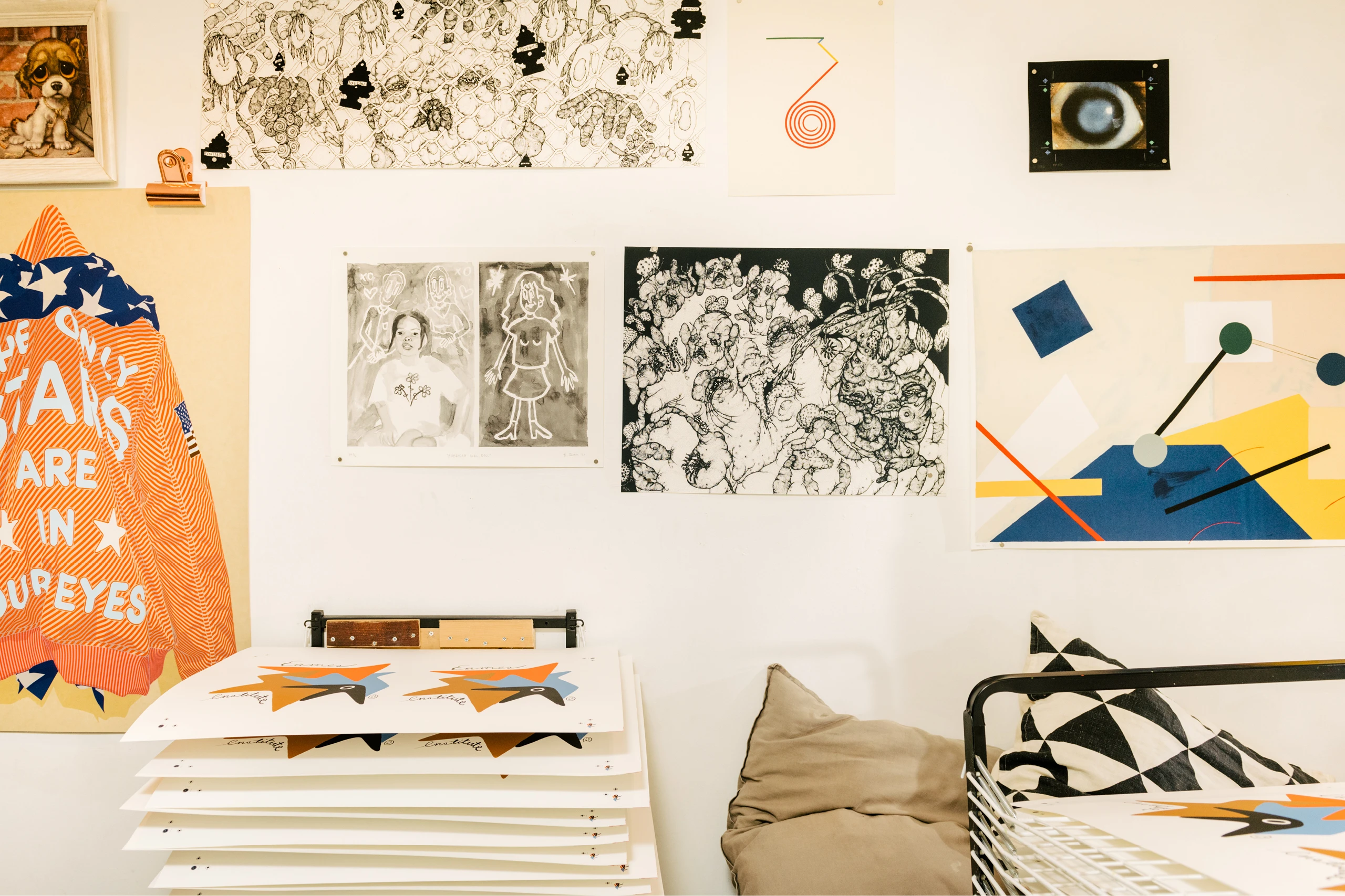 Interior view of Du-Good Press in Brooklyn featuring various prints on the wall.
