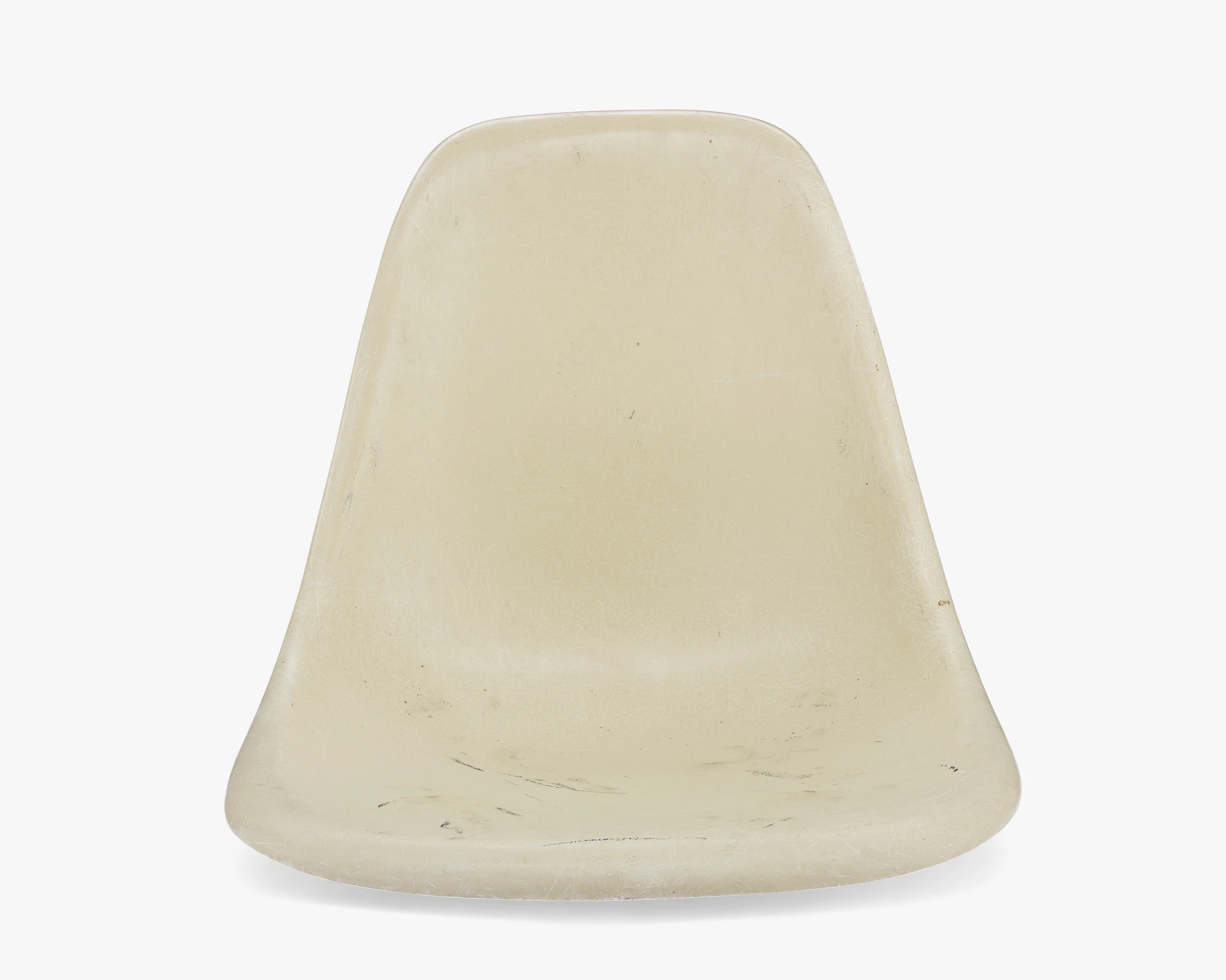 Front view of an Eames Fiberglass shell in the color “Parchment”.