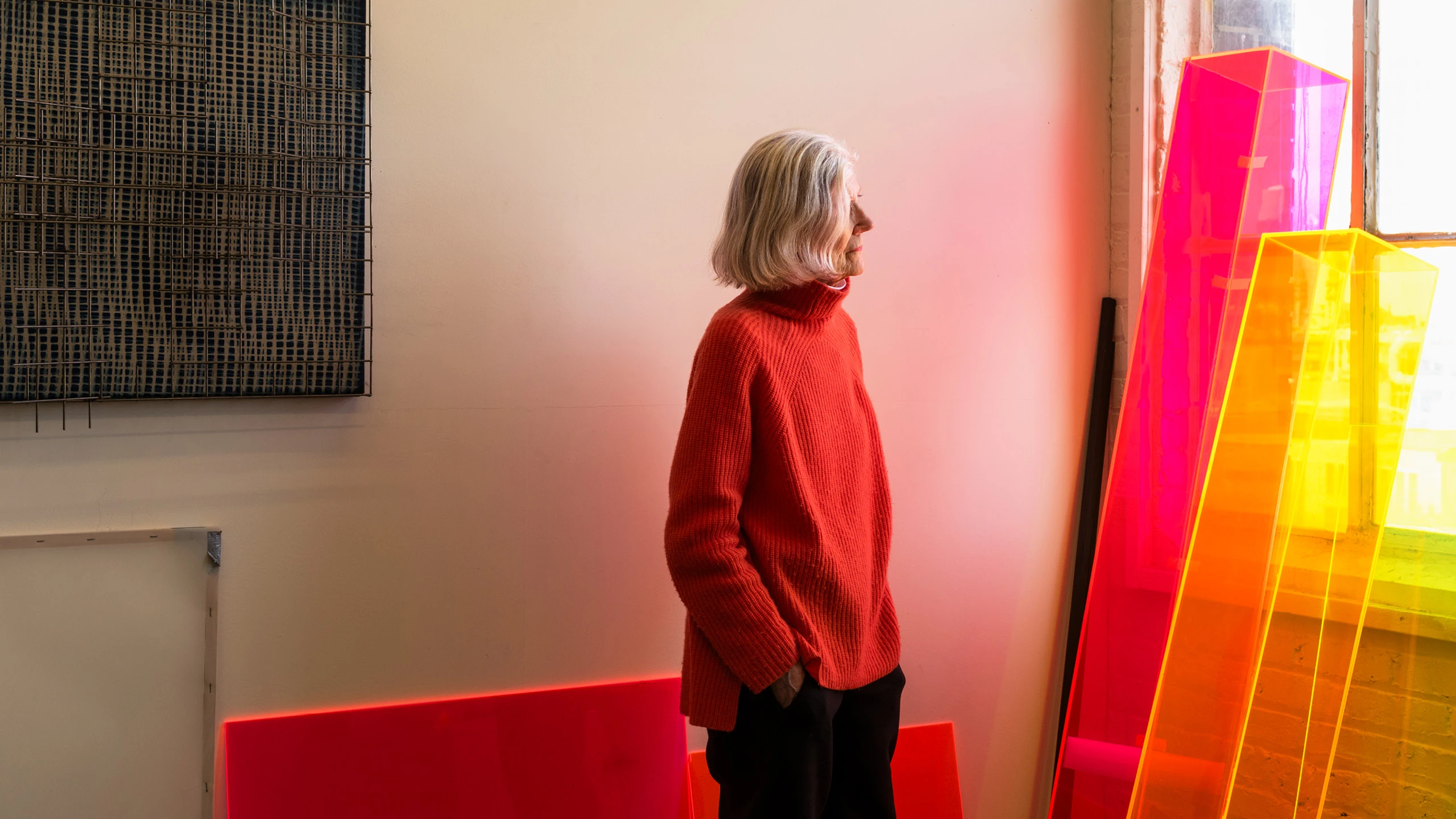 Artist Barbara Kasten in her Chicago studio with SHIELD XXIII (2022), and acrylic prototypes for Parallels (2018).