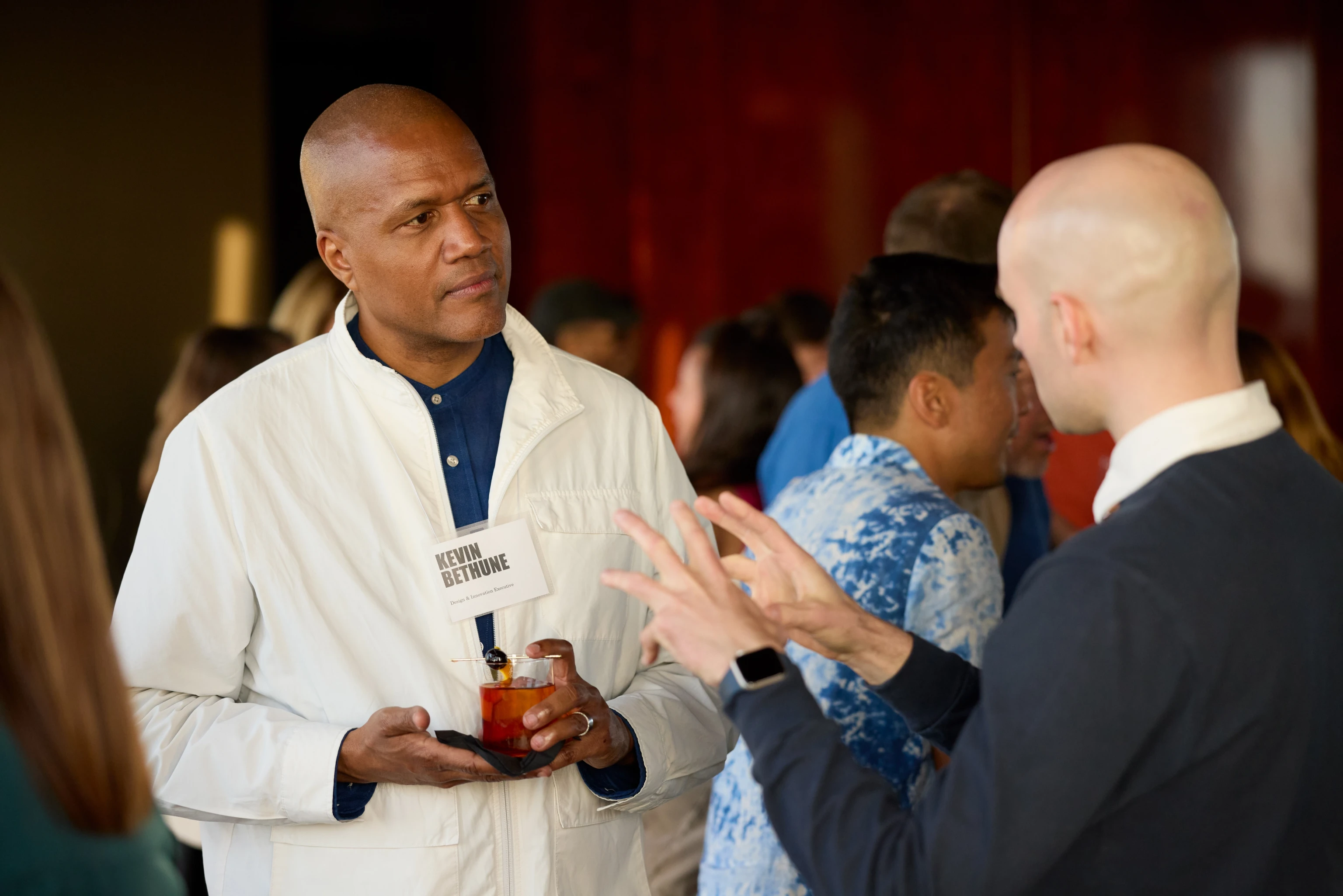 Members of The Design Vanguard in discussion during a dinner