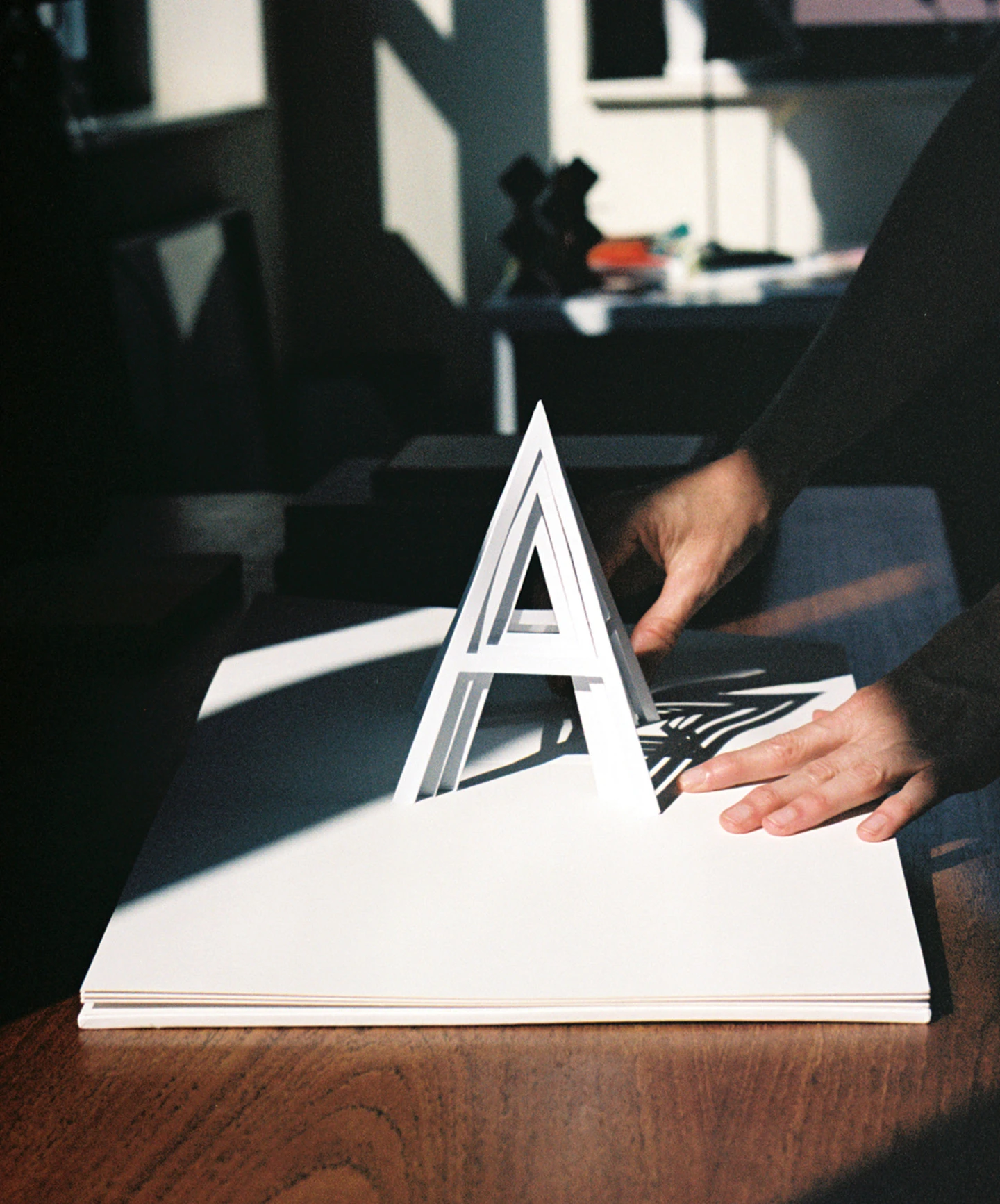 Typographic 3-D letter “A” paper design by paper engineer Kelli Anderson for her book, “Alphabet in Motion”.