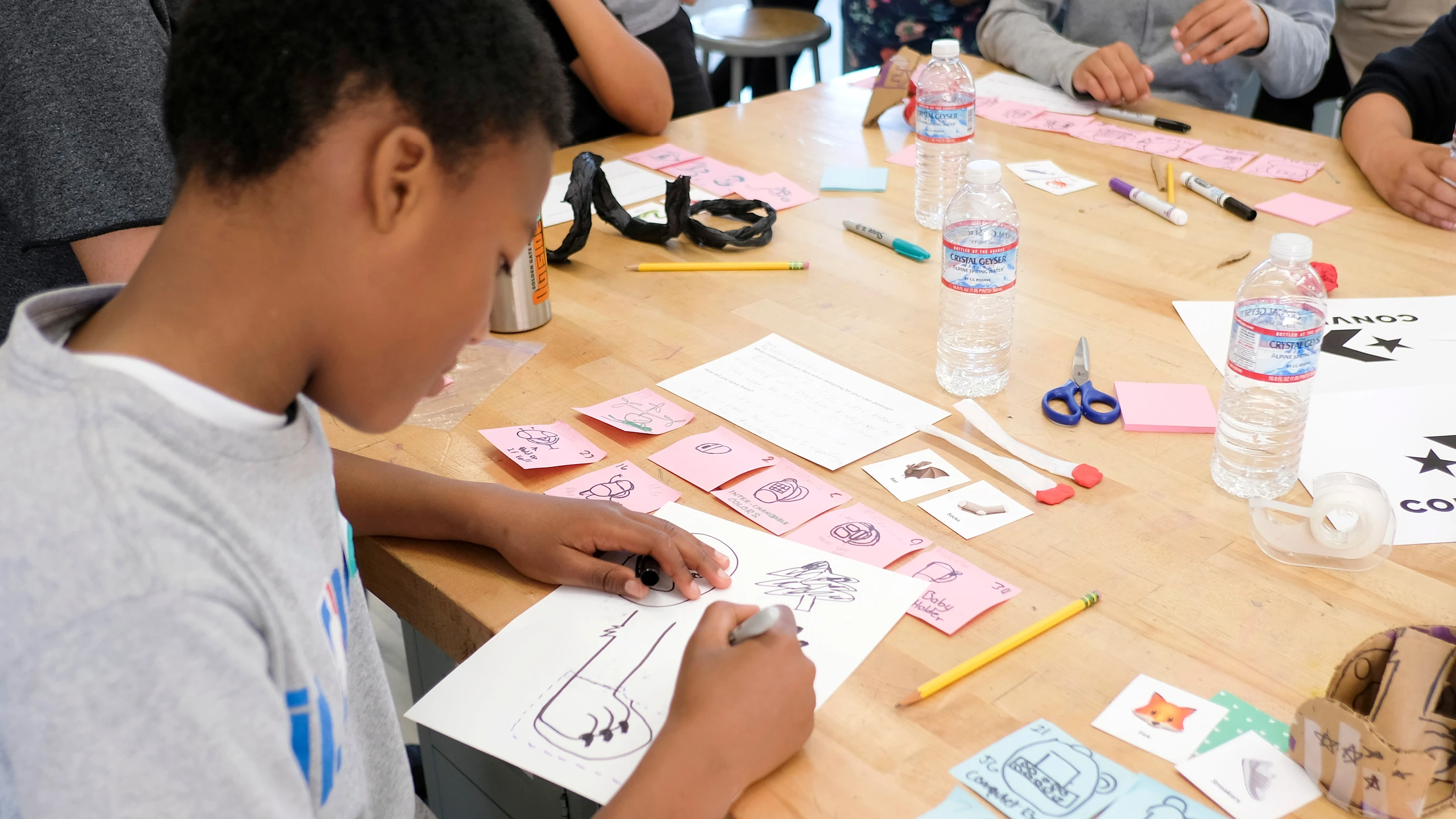 An Inneract Project design student working on exercises during a Youth Design Academy session in Oakland California.