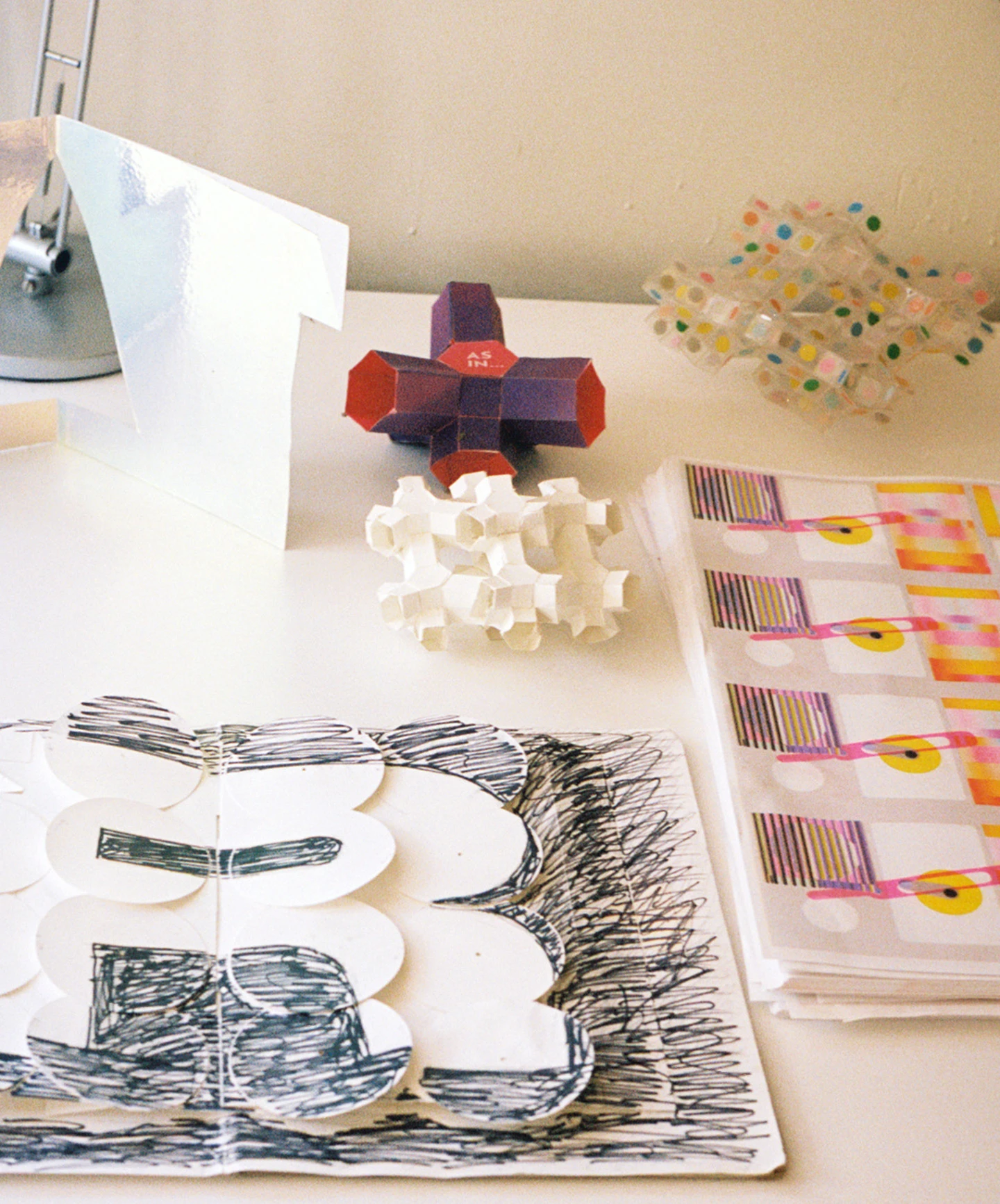 Mock up of the "Alphabet in Motion” pop-up book alongside 3-D paper models by designer and paper engineer Kelli Anderson.
