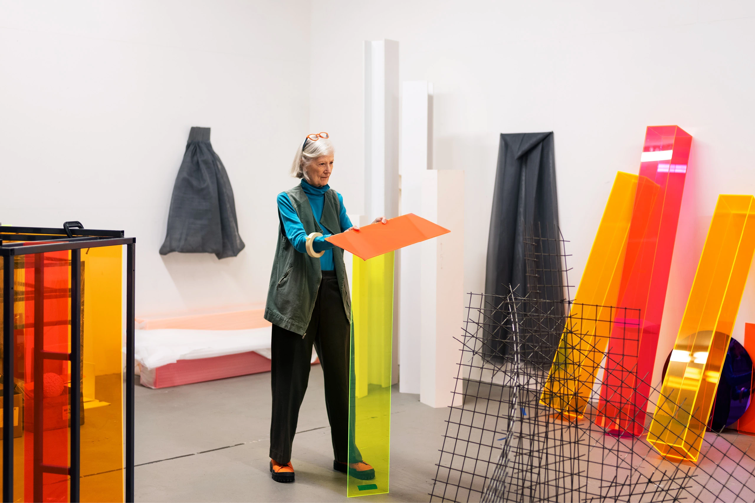 Artist Barbara Kasten in her Chicago studio working on assembling acrylic sheets for a piece.