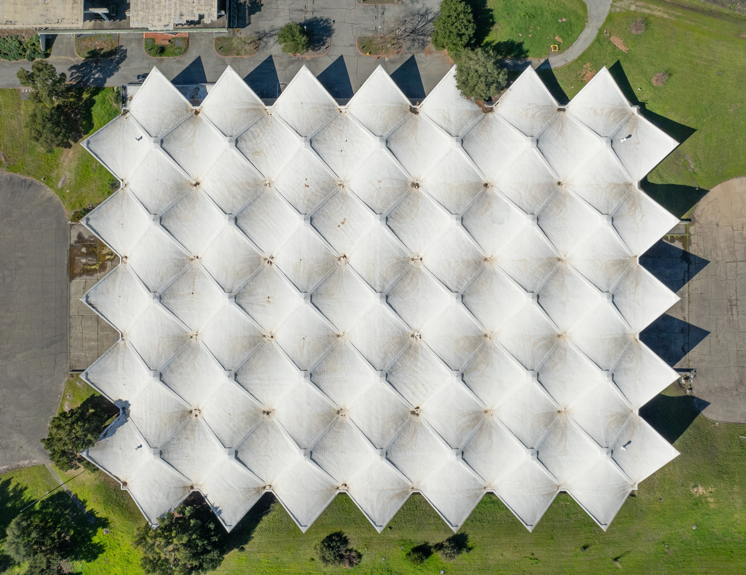 Ariel view of the sculptural geometry of the hyperbolic paraboloid concrete roof of the former Birkenstock campus.